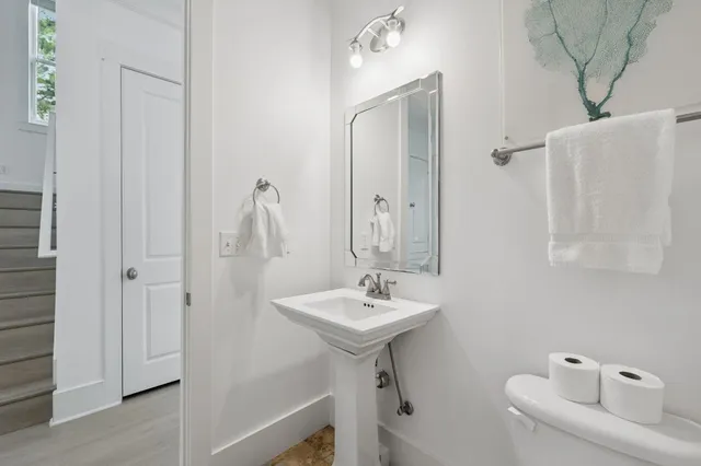 a view of a hallway with a livingroom and entryway