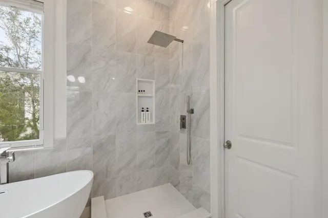 a bedroom with furniture and window