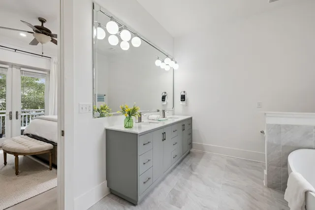 a bedroom with furniture and a window