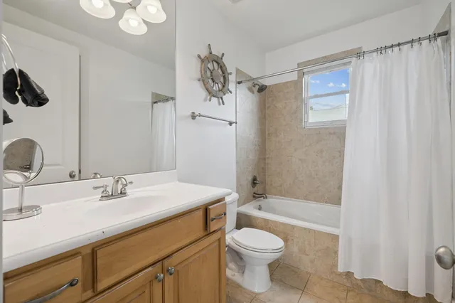 a view of a balcony with wooden floor