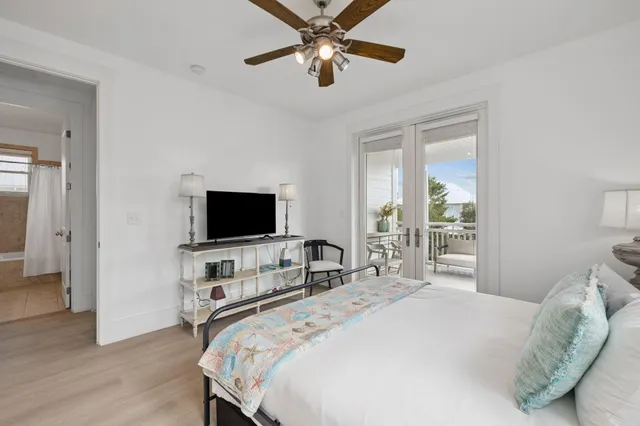 a balcony with furniture and a potted plant