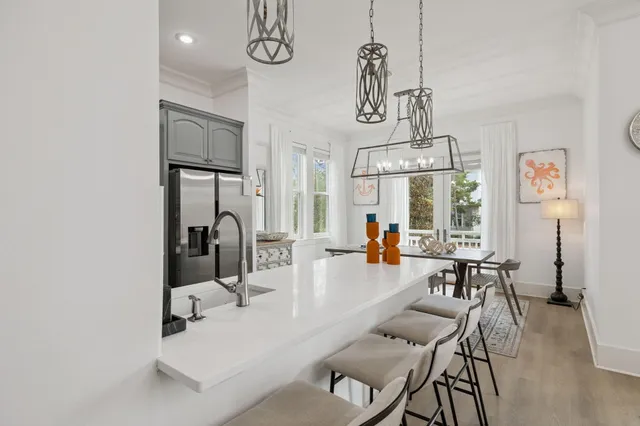 a kitchen with appliances a cabinets and a stove top oven