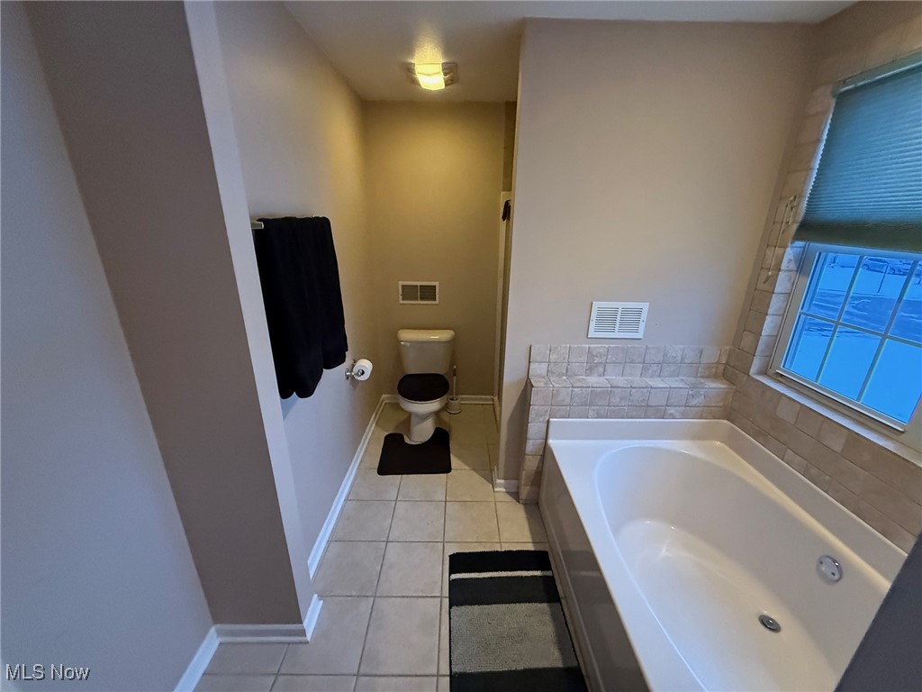 1201 Mulberry Run Mineral Ridge, OH 44440 - Photo 11 of 21 Bathroom featuring a tub, tile patterned floors, and toilet
