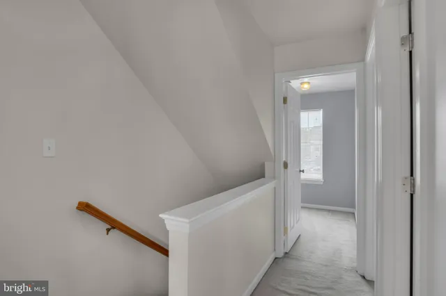 a view of a hallway with washer and dryer
