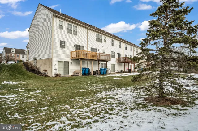 a view of a big house with a big yard