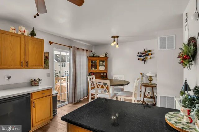 a living room with furniture potted plant and a chandelier