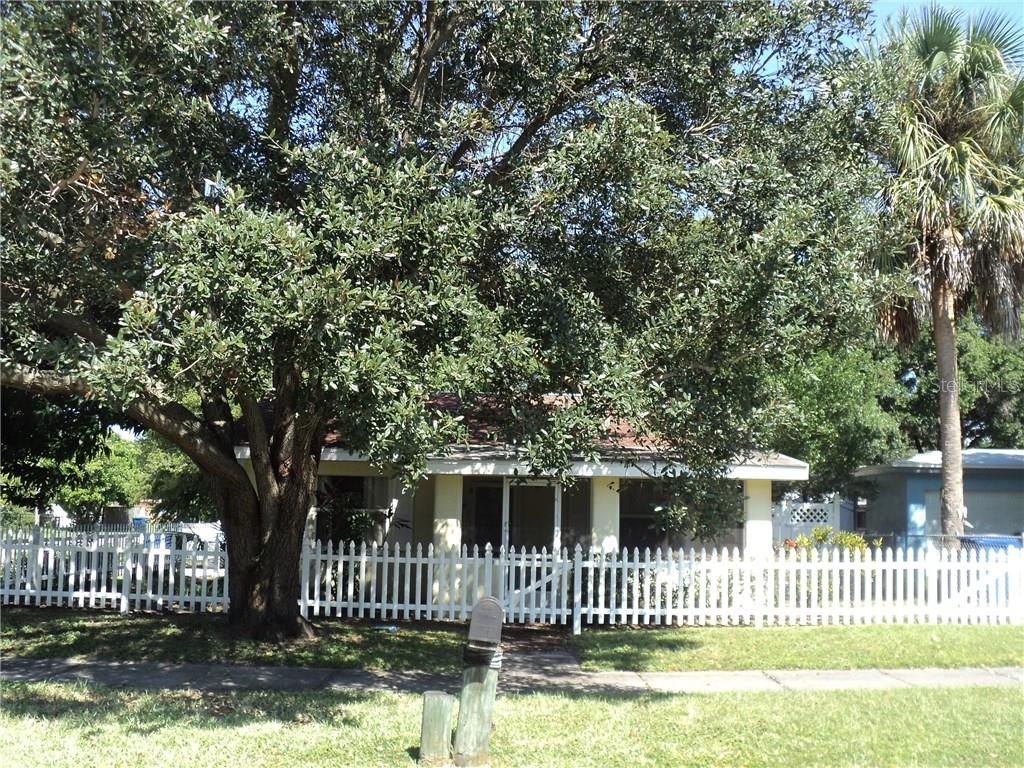 848 3rd Avenue Northwest Largo, FL 33770 - Photo 1 of 1 a front view of a house with a garden and deck
