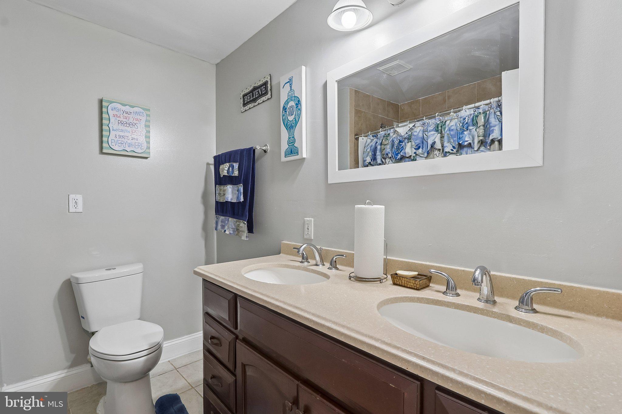 9003 Eldon Drive Clinton, MD 20735 - Photo 44 of 54 Charming dual-sink bathroom retreat.