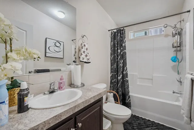 a bathroom with a toilet and a sink