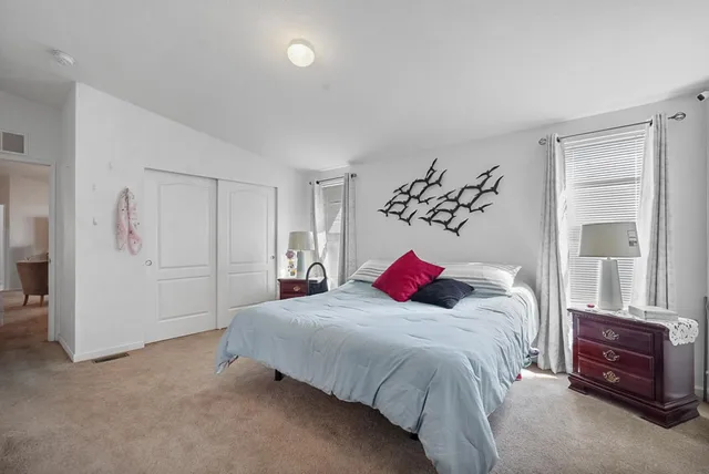 a bath tub sitting in a bathroom next to a window