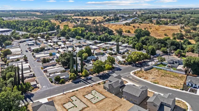 an aerial view of residential houses with outdoor space