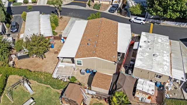 a balcony with wooden floor and stairs