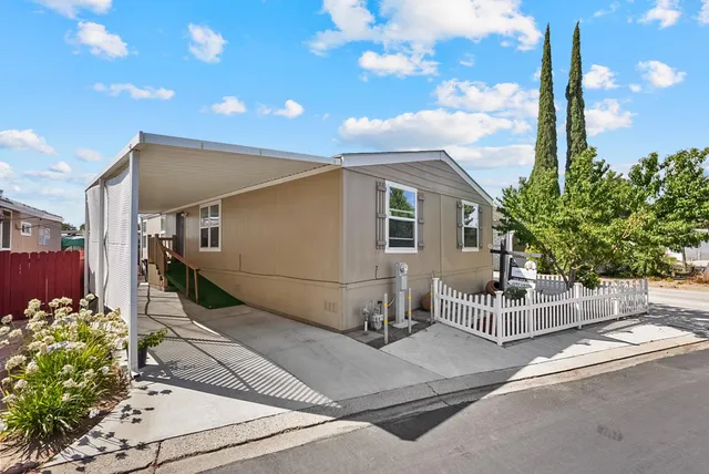 a view of a street with a bench in front of it