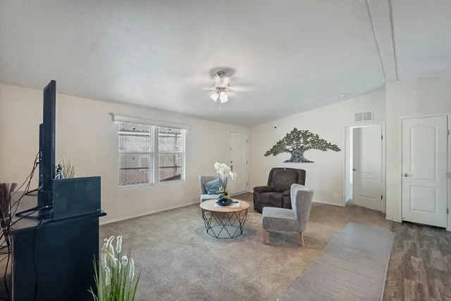 a living room with furniture and windows