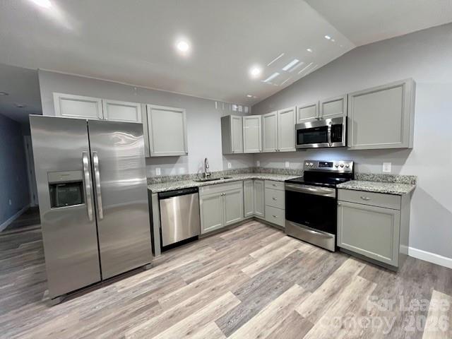 279 Pitts Street, Unit A Morganton, NC 28655 - Photo 2 of 7 a kitchen with granite countertop stainless steel appliances and white cabinets
