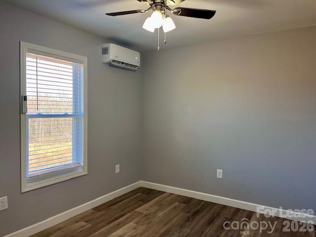 279 Pitts Street, Unit A Morganton, NC 28655 - Photo 5 of 7 an empty room with a window