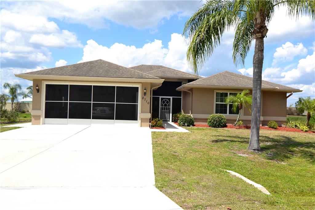8710 Southwest Liverpool Road Arcadia, FL 34269 - Photo 1 of 1 a front view of a house with a garden and porch