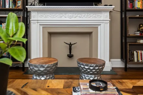a living room with furniture and a fireplace