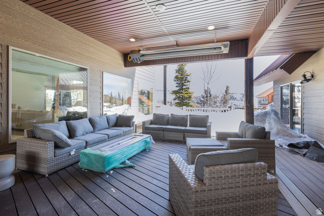 382 Ridgeview Street, Unit 8 & 9 Brian Head, UT 84719 - Photo 51 of 52 Covered outdoor living area featuring a wood-slat ceiling, recessed lighting, and a wall-mounted outdoor heater