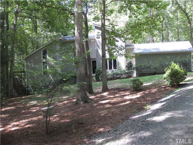 11929 Straight A Way Lane Raleigh, NC 27613 - Photo 1 of 20 Many windows in this soft contemporary. side entry garage Exterior Front