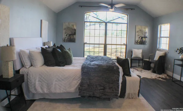 a bed room with a bed and a chair