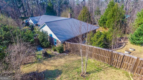 a view of a backyard with a small cabin