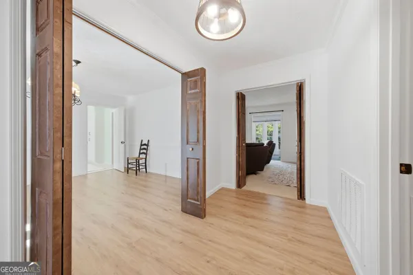 a view of a livingroom from a hallway