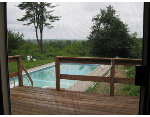 254 East County Road Rutland, MA 01543 - Photo 6 of 10 a view of swimming pool from a balcony