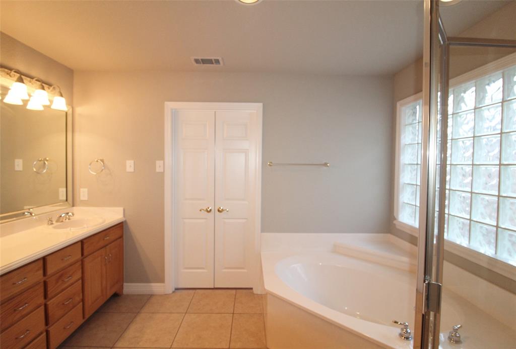 333 Blake Lane Midlothian, TX 76065 - Photo 15 of 25 a spacious bathroom with a tub shower and sink