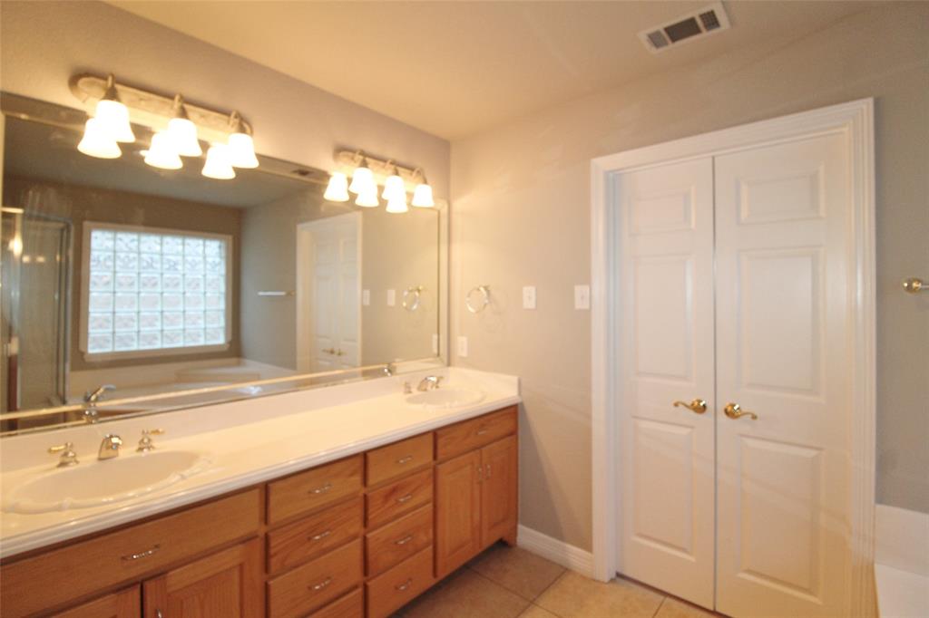 333 Blake Lane Midlothian, TX 76065 - Photo 16 of 25 a spacious bathroom with a double vanity sink mirror and double