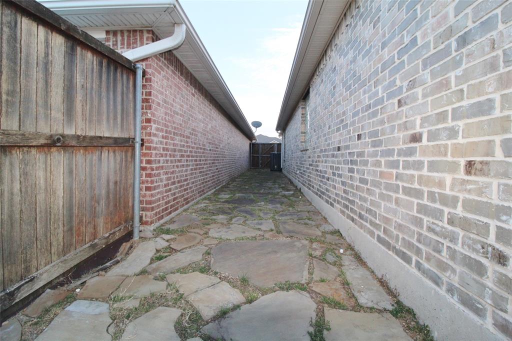 333 Blake Lane Midlothian, TX 76065 - Photo 25 of 25 a view of a pathway door with wooden fence