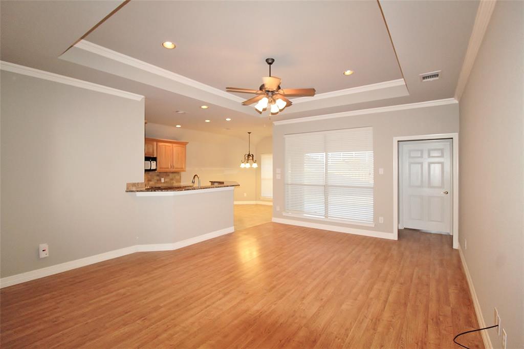 333 Blake Lane Midlothian, TX 76065 - Photo 6 of 25 a view of an empty room with window and wooden floor