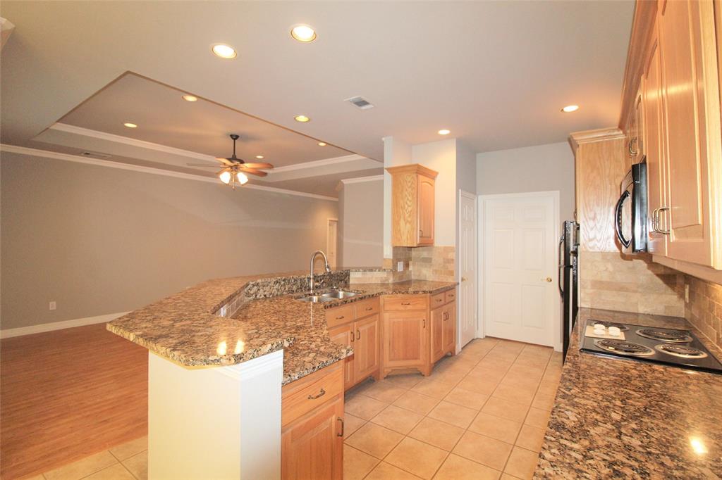 333 Blake Lane Midlothian, TX 76065 - Photo 10 of 25 a bathroom with a granite countertop sink and a mirror