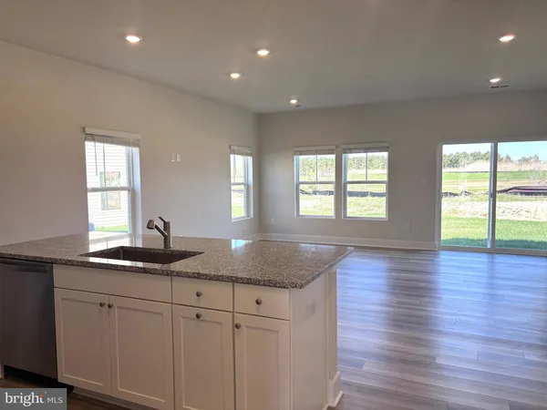 a kitchen with sink and window