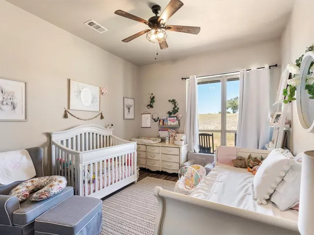 a bedroom with furniture and a window