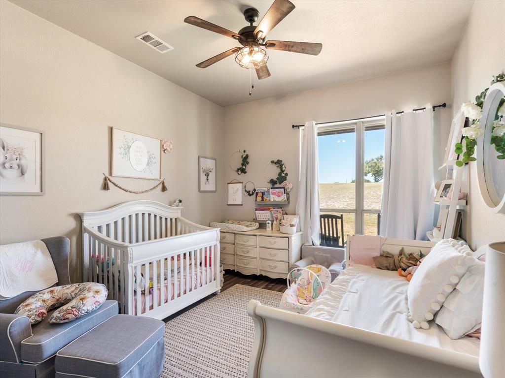 101 Trail Ridge Weatherford, TX 76087 - Photo 23 of 39 a bedroom with furniture and a window