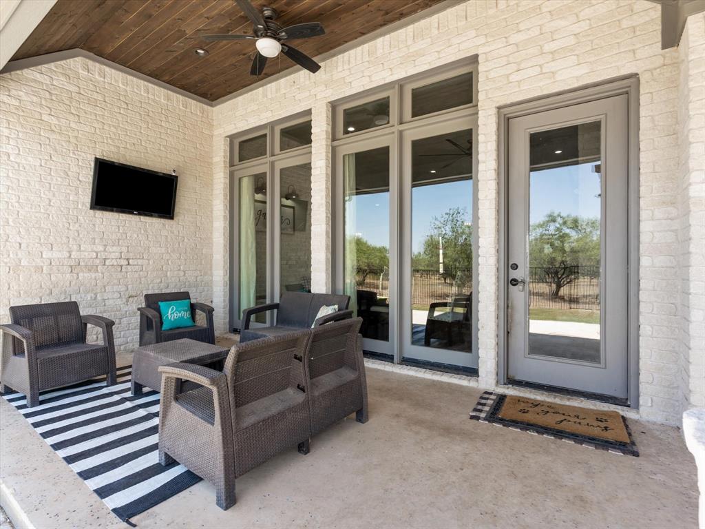 101 Trail Ridge Weatherford, TX 76087 - Photo 26 of 39 a living room with furniture and a flat screen tv