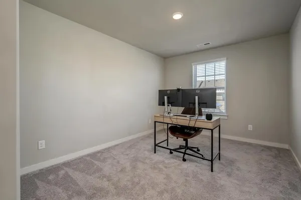 a view of a workspace with furniture