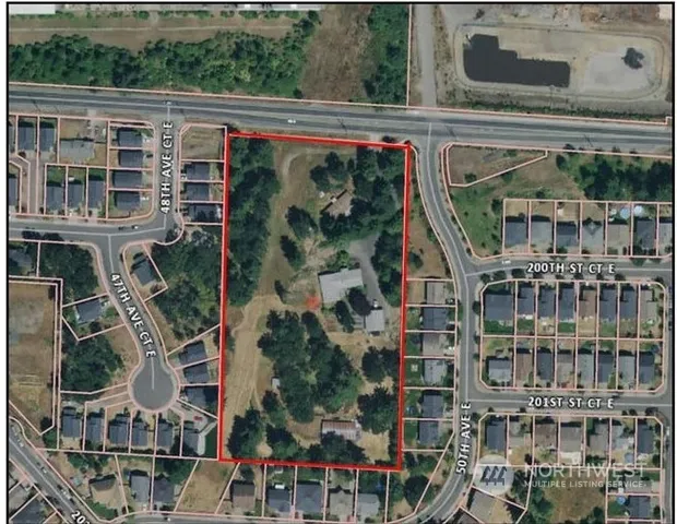 a view of a house with a yard and garage