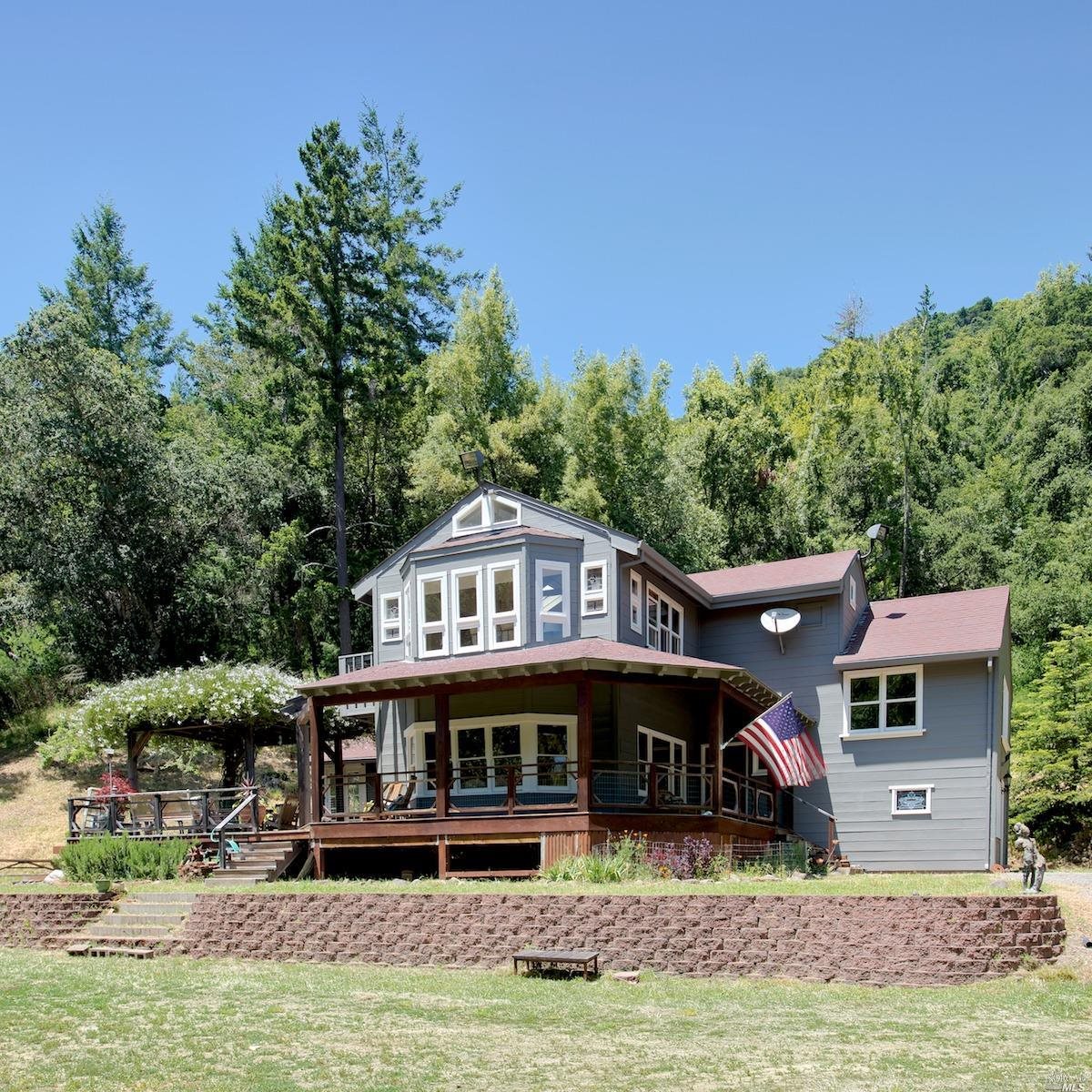 300 Bothin Road Fairfax, CA 94930 - Photo 1 of 1 a view of a big house with a big yard and large trees