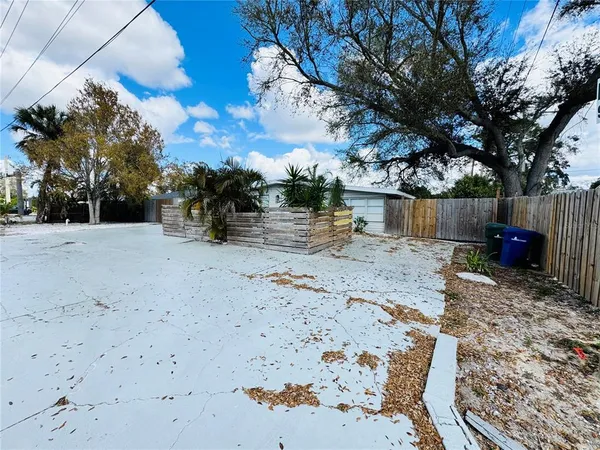 a spacious bedroom with a bed and window