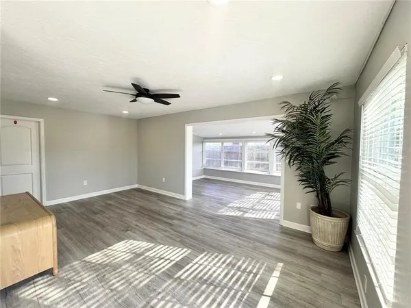 a kitchen with granite countertop stainless steel appliances a refrigerator sink and microwave