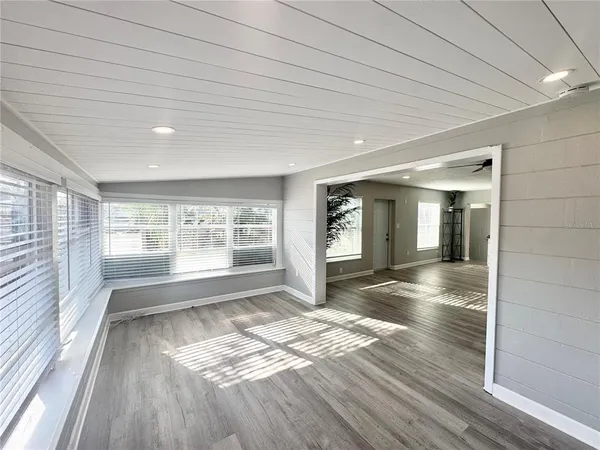 a kitchen with stainless steel appliances granite countertop a sink and a refrigerator