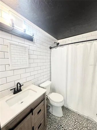 a view of a backyard with couches and a fire pit