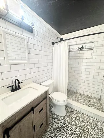 a backyard of a house with a table and chairs