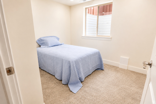 1055 North 1000 East Mapleton, UT 84664 - Photo 67 of 112 Carpeted room featuring light-colored walls, a single window with blinds, and white trim