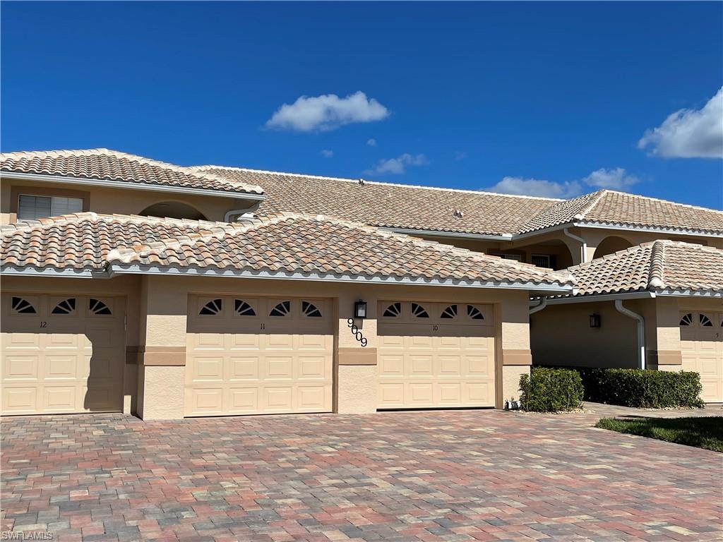 9009 Michael Circle, Unit 1110 Naples, FL 34113 - Photo 2 of 48 a front view of a house