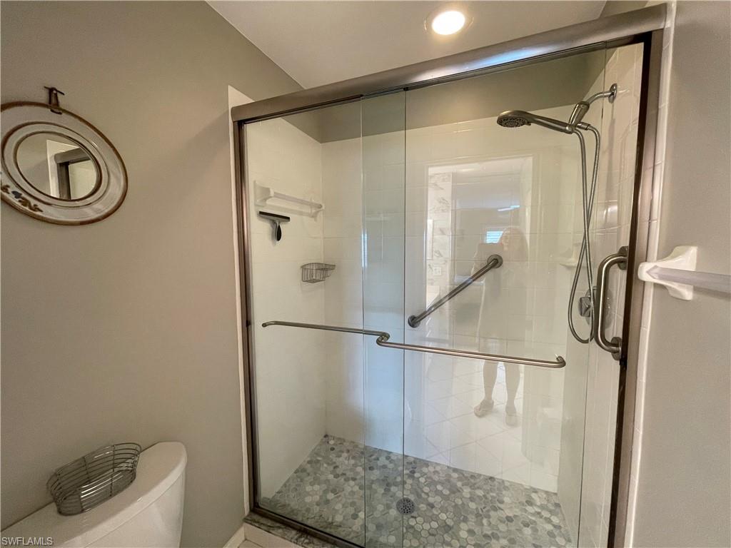 9009 Michael Circle, Unit 1110 Naples, FL 34113 - Photo 25 of 48 a bathroom with a shower