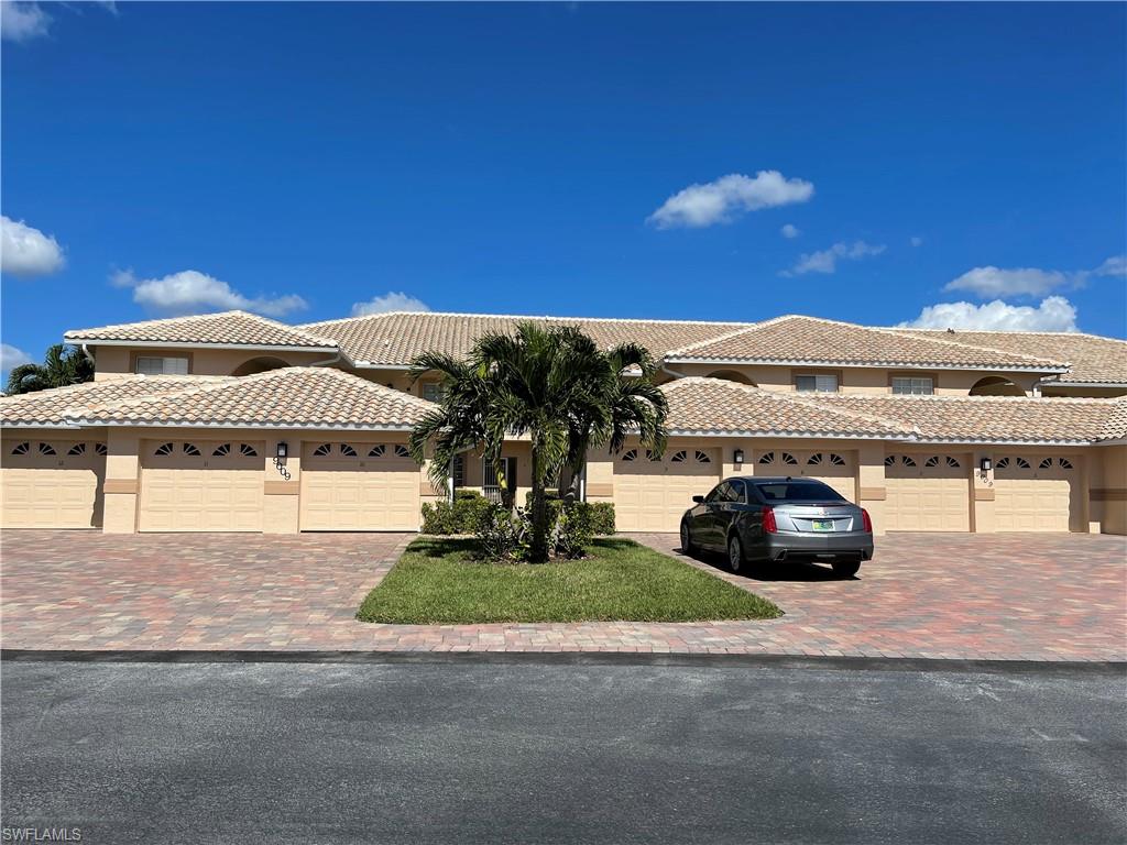 9009 Michael Circle, Unit 1110 Naples, FL 34113 - Photo 39 of 48 a view of a house with a patio