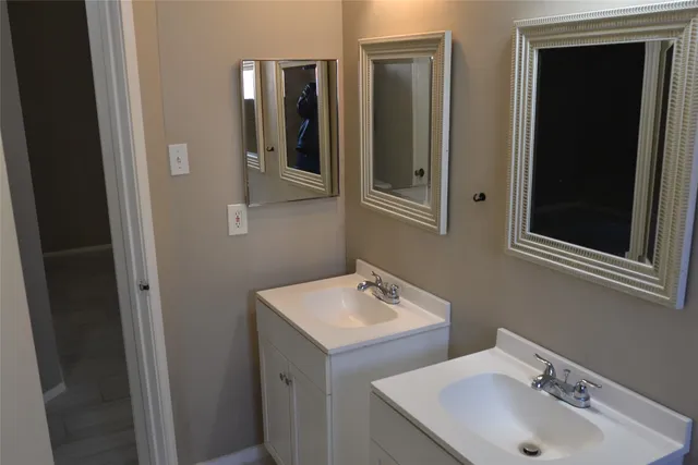 a bathroom with a sink and mirror